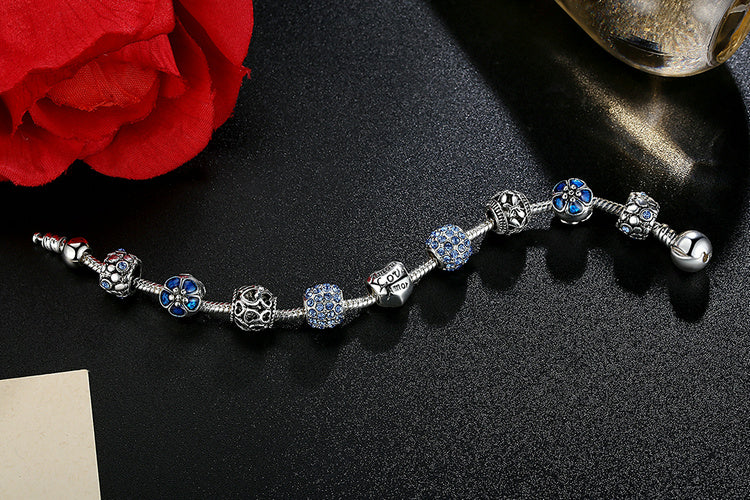 Silver Plated Charm Bracelet with Flower and Love Beads