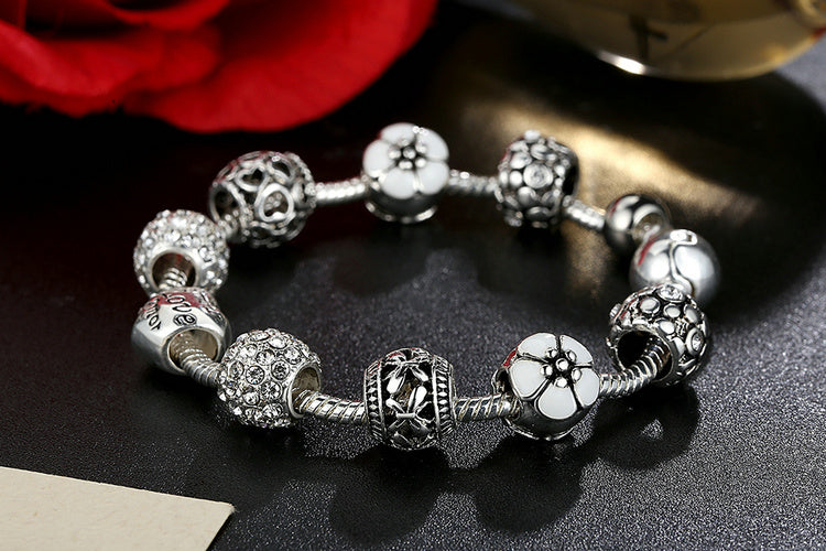 Silver Plated Charm Bracelet with Flower and Love Beads