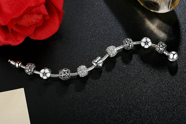 Silver Plated Charm Bracelet with Flower and Love Beads